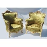 A pair of ornate gilt and painted Duchess style salon chairs,