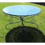 A painted metal circular metal garden table, with pierced decoration and scroll apron,