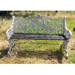 A metal painted garden seat, with ornate gold leaf and vine decoration, and slatted seat,