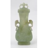 A Chinese carved jade STYLE covered vase, of oval baluster form, with ring handles,