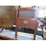 A 19th century tray top commode, having a tambour sliding door, over single drawer,