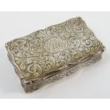 A Victorian silver snuff box, of shaped rectangular form with engraved scroll decoration,