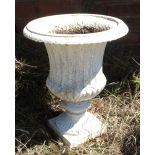 A Regency style cast garden urn, with reeded body raised on a square base, height 19ins,