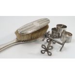 A collection of hallmarked silver, to include two silver backed brushes, four various napkin rings,
