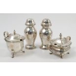 Two silver pepper pots, of baluster form with ribbed edge, London 1904 and 1914, weight 2oz,