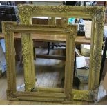 A 19th century ornate gilt frame, with moulded decoration, internal dimensions 27ins x 37ins,