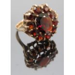 A 9ct gold garnet cluster ring, finger size Q1/2, weight 4.