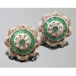 A pair of emerald and diamond cluster ear clips, the central emerald enclosed by eight diamonds,