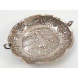 An oval silver dish, decorated with a figure in rural landscape, London 1882,