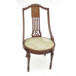 An Edwardian mahogany nursing chair, with marquetry inlay and pierced splat back,