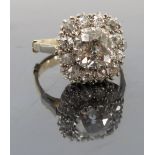 A diamond cluster ring, the principal old mine cut stone of approximately 1.