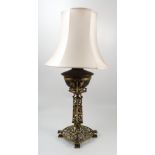 An Art Nouveau pierced gilt metal lamp base, converted from an oil lamp,