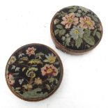 A pair of 19th century circular footstools, with needlework bases,