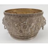 A Victorian silver circular bowl, decorated with embossed flowers and leaves,