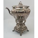 A silver plated spirit kettle on stand, with various engraved decoration,