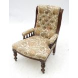 A 19th century mahogany gallery sided nursing chair