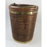 A late George III mahogany and brass bound peat bucket,