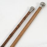 A walking stick, with bamboo shaft, the white metal cap with woven decoration,