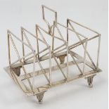 A silver plated five bar toast rack, the wire work bars of rectangular form with a cross,