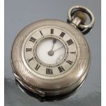 A silver half hunter pocket watch, the white enamel dial with black Roman numerals,