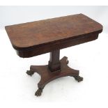 An early 19th century burr yew wood D-shaped fold over games table, with cross banded top,