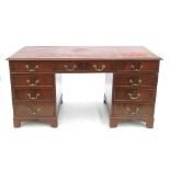 A Georgian design mahogany rectangular desk, fitted three frieze drawers,