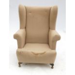 A fireside wing armchair