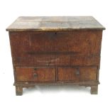 A small Antique oak mule chest, with rising lid fitted two drawers below, raised on bracket feet,