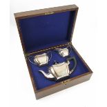 A cased silver three piece tea set, Sheffield 1935, maker George Butler & Co Ltd,