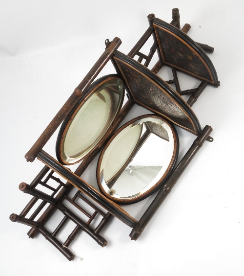 An Edwardian set of bamboo effect corner shelves, decorated in the Aesthetic style,