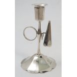 An early Victorian silver chamberstick, with shaped sconce, loop handle and snuffer to the stem,