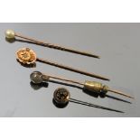 A chrysoberyl cats eye and diamond stick pin, cased,