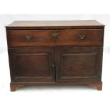 A 19th century oak secretaire, the secretaire drawer fitted with drawers and pigeon holes,