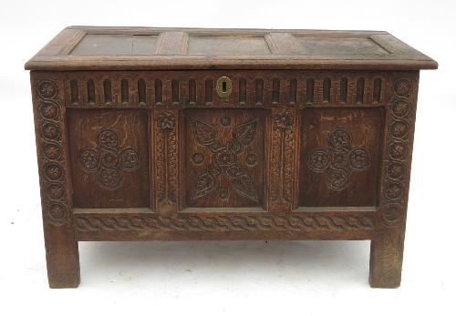 An 18th century oak coffer, with three panelled plain rising lid,