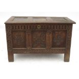 An 18th century oak coffer, with three panelled plain rising lid,