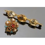 A Victorian enamel and stone set cinquefoil brooch, together with a modern 9ct gold brooch,