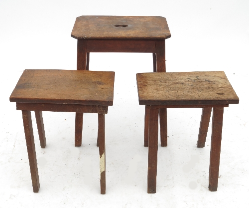 A late 19th century oak rectangular topped stool, with carry handle aperture,