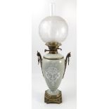 A table lamp, formed as green glazed vase, with pate sur pate decoration, and gilt metal mounts,