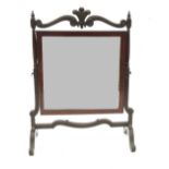 A 19th century mahogany swing frame toilet mirror, surmounted with fleur de lys, width 20.