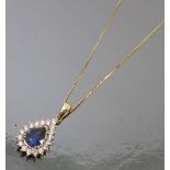 A sapphire and diamond cluster pendant, stamped '18K',