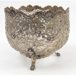 A pierced white metal sugar bowl mount, with pierced body decorated with birds and foliage,