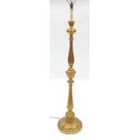 A gilt standard lamp, with turned and fluted column,