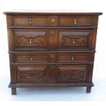 A 17th century style oak chest of drawers, having two pairs of long drawers with moulded fronts,