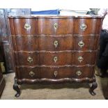 A 19th century Continental oak break front chest, of double serpentine outline,