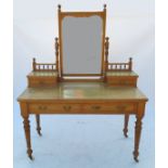 A pale oak dressing table, with mirror back supported by drawers and galleries,