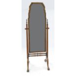 A walnut cheval mirror, with bevelled plate, in the George II style,