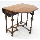 A William and Mary design walnut gate leg dining table, having a shaped cut corner crossbanded top,