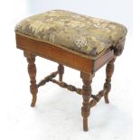 A late Victorian/Edwardian adjustable piano stool, having tapestry upholstered seat,