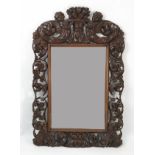 A 19th century Flemish style oak framed mirror,