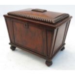 A Gillows mahogany wine cooler, of sarcophagus form, with rising lid,